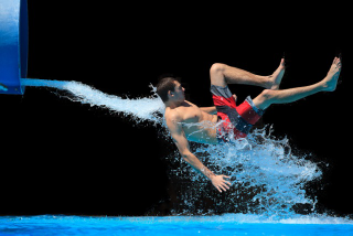 Illustration for article titled The Absurd Joy Of Waterslides Is Captured In These Perfectly Timed Shots